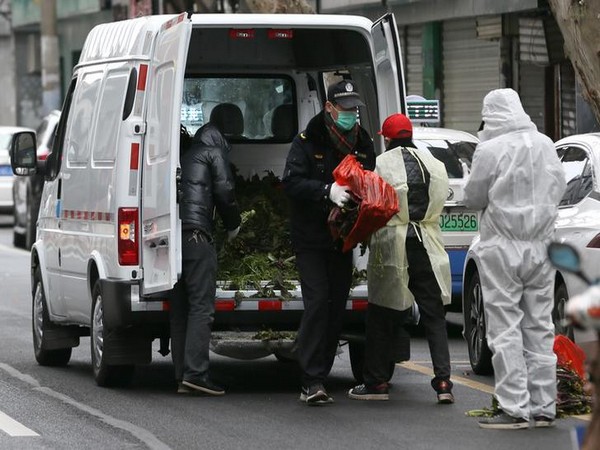 Community volunteers deliver donated vegetables to elderly residents at Furen community on Lantern Festival