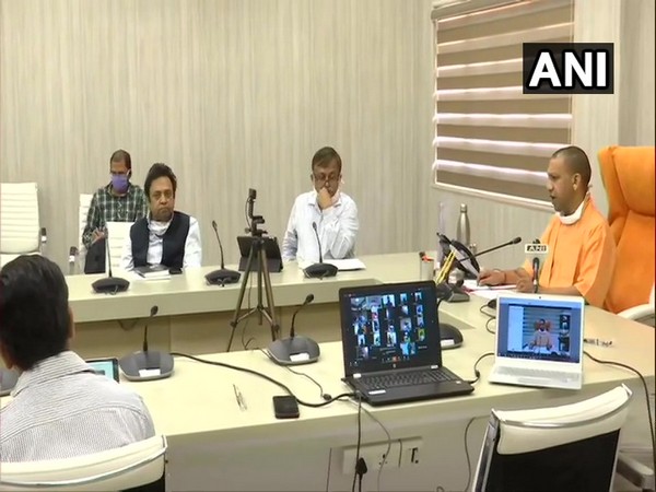 CM Yogi interacts with students brought back from Kota amid lockdown. Photo/ ANI