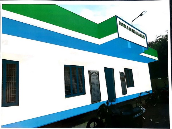 Visual of a village secretariat in Andhra Pradesh painted in YSRCP's flag colour. Photo/ANI
