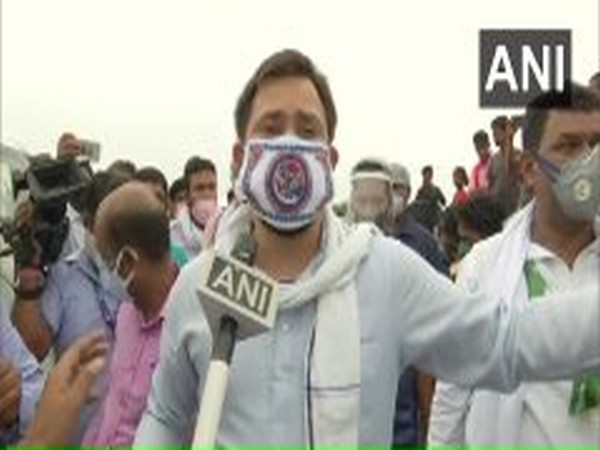 RJD leader Tejashwi Yadav during a visit to flood-affected areas in Darbhanga on Wednesday.