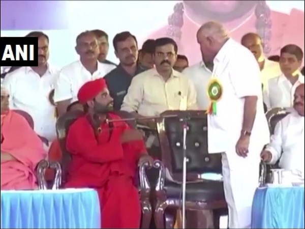 Karnataka Chief Minister BS Yediyurappa with Swami Vachananda at the event in Davanagere on Tuesday. Photo/ANI