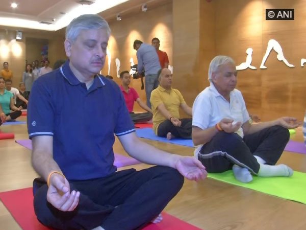 AIIMS Director Dr Randeep Guleria (left) doing yoga 