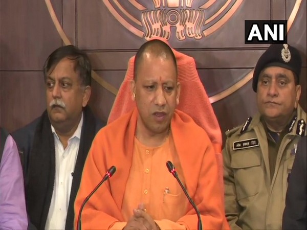 Uttar Pradesh Chief Minister Yogi Adityanath speaking to reporters in Lucknow on Monday.