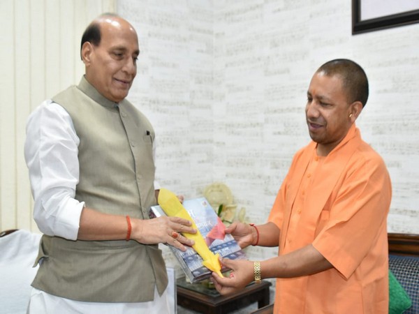 UP Chief Minister Yogi Adityanath meeting Defence Minister Rajnath Singh in New Delhi on Sunday. (ANI/Photo)