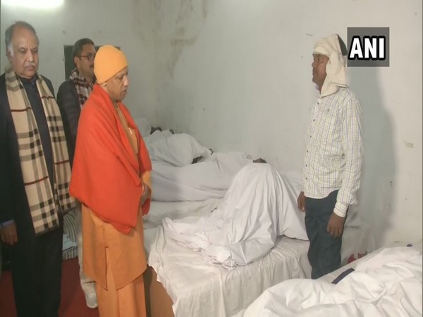 Uttar Pradesh Chief Minister Yogi Adityanath interacting with a night shelter occupant in Varanasi on Friday.