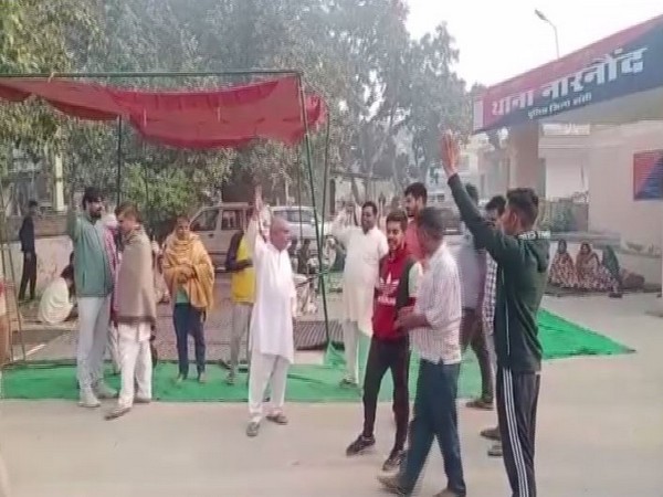 Farmers protesting outside Narnaund police station in Haryana (Photo/ANI)