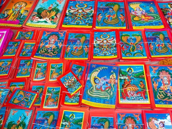 Murals of gods and goddesses on display in a market in Kathmandu