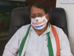 
      
      MP Cong leaders adorn masks seeking 'return of Kamal Nath govt' 
      
      