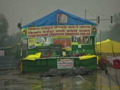 
      
      Protesting farmers make their tents waterproof amid heavy rainfall
      
      