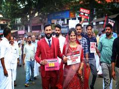 
      
      Kerala couple protests against CAA, NRC on their wedding day
      
      