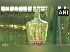 
      
      Odisha artist crafts eco-friendly idol of Ganesha inside bottle
      
      