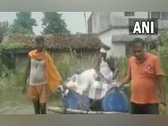 
      
      Bihar patient carried on makeshift boat
      
      