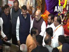 
      
      Amit Shah offers prayers at Lalbaugcha Raja with Eknath Shinde
      
      