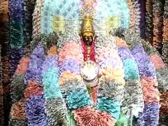 
    Goddess Vasavi Kanyaka Parameswari adorned with notes, ornaments
    