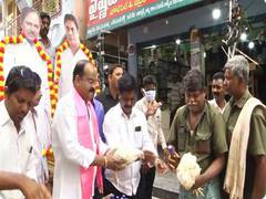 
      
      Telangana: TRS leader distributes liquor bottles, chicken
      
      