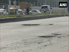 
      
      Gurugram: Potholes on NH-48 cause inconvenience to commuters
      
      