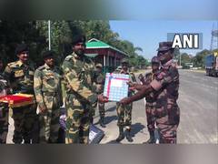 
      
      BSF, Border Guards Bangladesh exchange sweets on Diwali
      
      