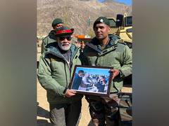 
      
      Gujarat student meets Narendra Modi again as an Army Major 
      
      