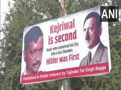 
      
      Poster comparing Kejriwal to Adolf Hitler put up outside BJP HQ
      
      