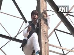 
      
      AAP's ex-councillor climbs a transmission tower in Delhi
      
      