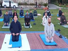 
      
      Uttarakhand CM performs yoga with administrative officials
      
      