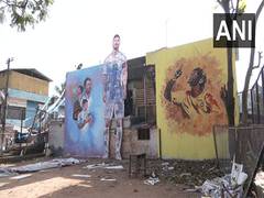 
      
      Daily wage workers paint their colony to celebrate FIFA WC
      
      