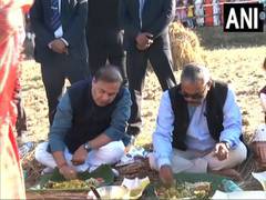 
      
      Assam CM eats lunch with locals in paddy field
      
      