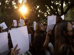 
      
      China's President Xi bows down to female protesters
      
      