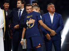 
      
      Macron consoles French team after defeat to Argentina in WC final
      
      