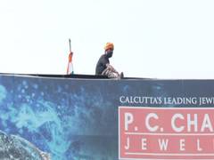 
      
      Odisha: Man climbs hoarding, threatens suicide
      
      