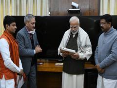 
      
      Pradhan presents 'India: The Mother of Democracy' to PM Modi
      
      