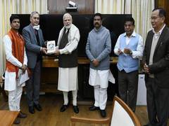 
      
      Pradhan presents book India: The Mother of Democracy to PM Modi
      
      