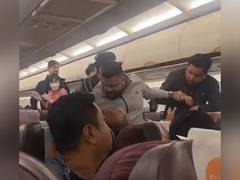 
      
      Row erupted after passenger refused to follow crew's instructions
      
      