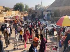 
      
      Tourists throng golden city of Jaisalmer for New Year 
      
      