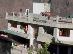 
      
      Demolition of damaged Hotel Malari Inn underway
      
      