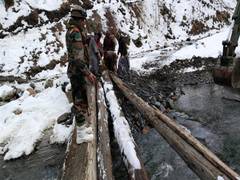 
      
      J-K: Army builds wide wooden bridge help locals
      
      
