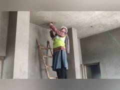 
      
      Woman electrician doing door to door electrical fitting work 
      
      