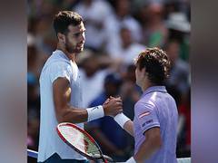 
      
      Australian Open: Karen Khachanov cruises past Nishioka into QFs
      
      