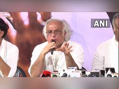 
      
      Congress takes jibe at Adani's 