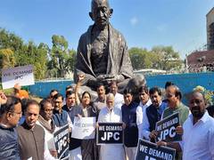 
      
      Opposition MP's protest in Parliament premises on Adani row
      
      