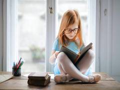 
    Daily reading may improve language development in kids: Study
    