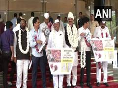 
      
      NCP MLAs don onion garland, seek relief as prices plummet
      
      