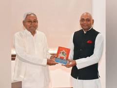 
      
      Abhay presents copy of 'The Book of Bihari Literature' to Nitish 
      
      