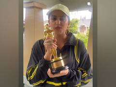 
      
      Huma Qureshi poses with producer Guneet Monga's Oscar trophy
      
      