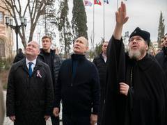 
      
      Putin visits Crimea on anniversary of its annexation from Kyiv
      
      