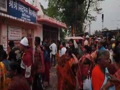 
      
      Pilgrims take a holy dip in the Barak River at Badarpur
      
      