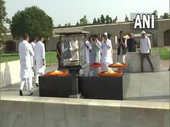 
      
      Congress leaders pay tributes at Raj Ghat amid 'Satyagraha'
      
      