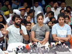 
      
      Wrestlers urge Amit Shah to take action against 