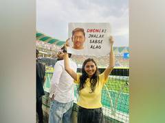 
      
      Dhoni's fans go wild with enthusiasm under the falling rain
      
      