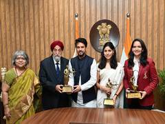 
      
      National Sports Awardees collect their awards from Anurag Thakur
      
      